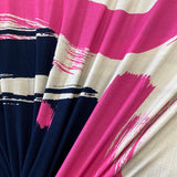 A navy viscose jersey with geometric design in pink, beige and white. Kayes Textiles fabrics