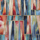 A heavy tapestry fabric with a geometric design in blues and reds with gold outlining. Kayes Textiles Fabrics.