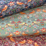 A slection of three fabrics, one navy, one grey and one damson all with the same bird and floral design. Kayes Textiles Fabrics