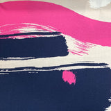 A navy viscose jersey with geometric design in pink, beige and white. Kayes Textiles fabrics