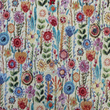 A natural coloured heavy tapestry fabric with coloured flowers all over . Kayes Textiles Fabrics.