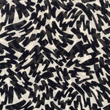 A chiffon fabric with an all over black and white abstract design. Kayes Textiles fabrics.