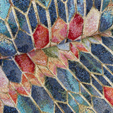 A heavy tapestry fabric with a geometric design in blues and reds with gold outlining. Kayes Textiles Fabrics.