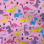 ** Remnant 150101 0.7m Polycotton smiling dinosaurs - Pink - 114cm wide approx