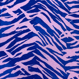 A jersey fabric with a royal blue and pink zebra style animal print design. Kayes Textiles fabrics