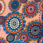An abstract design of kaleidoscope style circles in blue and coral. Kayes Textiles Fabrics