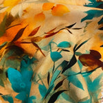 A floaty viscose fabric with orange and teal flowers and leaves on an orange sunset colour background Kayes Textiles Fabrics