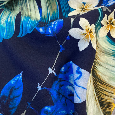 A floaty viscose fabric with large tropical flowers and leaves on a navy background Kayes Textiles Fabrics