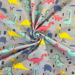 Polycotton Children's Print - Smiling Dinosaurs - Grey - £3.00 Per Metre - Sold by Half Metre