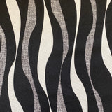 A heavyweight cotton with a geometric wave design in black and cream all across the fabric. Kayes Textiles Fabrics.