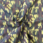 A traditional camouflage print in greens and black. Kayes Textiles Fabrics. 