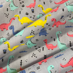 Polycotton Children's Print - Smiling Dinosaurs - Grey - £3.00 Per Metre - Sold by Half Metre