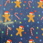 Remnant 160908 2.6m x 1.12m Polycotton gingerbread man and candy canes DAMAGED