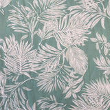 A mint viscose fabric with white brushed lotus leaves all over. Kayes Textiles Fabrics.
