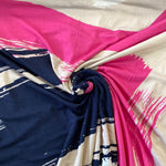 A navy viscose jersey with geometric design in pink, beige and white. Kayes Textiles fabrics