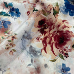 A floaty viscose fabric with rose and teal flower blooms on an ivory background Kayes Textiles Fabrics