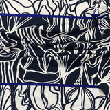 A crepe jersey with a double border. Dark navy centre with white abstract design then white borders with navy abstract design. A cobalt blue strip sperates the border sections. Kayes Textiles fabrics