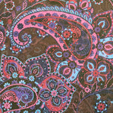 A sheer chiffon fabric with a purple and blue paisley design all over. Kayes Textiles Fabric