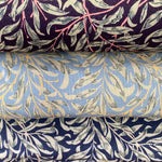 Three fabrics, one grey one navy and one damson all with the same willow pattern all over the fabric. Kayes Textiles Fabrics