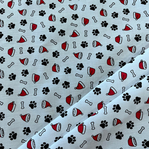 Remnant 230102 1.35m Christmas polycotton paws white - 112cm wide approx