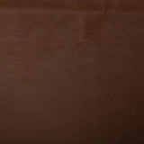 A faux leather fabric with a slight texture in a brown colour. Kayes Textiles Fabrics