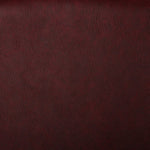 A faux leather fabric with a slight texture in a wine colour. Kayes Textiles Fabrics.