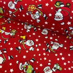 100% Cotton Poplin  - Christmas - Playful Santa - Select Colour - £6.50 Per Metre - Sold by Half Metre