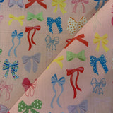Pretty Multicoloured Bows on Pink Polycotton Print - £3.00 Per Metre -  Sold by Half Metre