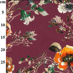 A floaty viscose fabric with a mix of flowers and stems on a mauve background Kayes Textiles Fabrics