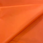 A plain bright orange waterproof fabrics