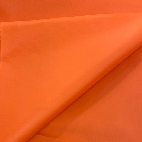 A plain bright orange waterproof fabrics